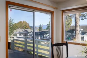 The sliding door looking out over the deck and the water views.