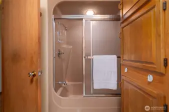 Main bathroom with shower bath combo.
