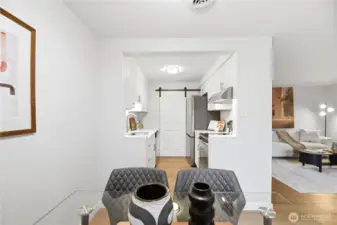 The galley kitchen entry has been creatively opened to improve flow and provide a brighter, more open and spacious feel.