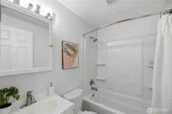 New tub/shower surround has been installed, offering a fresh, clean look with updated finishes and easy-care surfaces—perfectly blending style and functionality for everyday comfort.