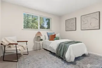 A bright and airy third bedroom that showcases the home’s incredible versatility. Currently staged as a playful retreat, the room’s generous proportions and clean lines make it an ideal canvas for any residential need.