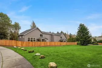 Burke Gilman Trail  sets behind the home.   for P, ivacy & Grassy area maintained by Seattle utilities.