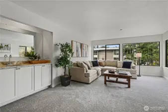 Living room also features a wet bar and extra storage cabinets that add flexibility for hosting or everyday living, would make a perfect coffee bar!
