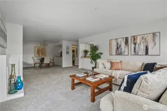 From this angle, the open-concept design seamlessly connects the living room, dining area and kitchen, creating a warm and welcoming space for gatherings.