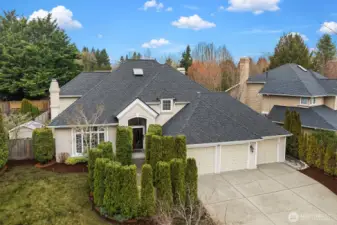 Timeless curb appeal is on full display with a new roof, classic stone and stucco facade, three-car garage, and manicured landscaping, a picture-perfect welcome to this exceptional Trossachs home.