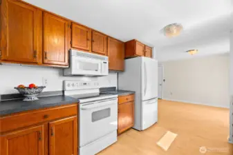 The kitchen opens to the dining room and has easy access to the patio and deck.