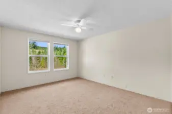 The primary suite upstairs with newer paint, brand new carpet, walk-in closet and 3/4 bath ensuite.