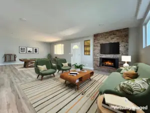 Lower level family room with wood burning fireplace.