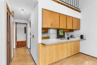 Pass through from kitchen to dining area.  Imagine the options to enlarge the kitchen,  pushing it out and adding a large island.  Plenty of space to do that.