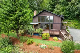 Large deck and a wall of windows.  Relax in the sun on the front deck or watch the entertainment from inside with a warm fire glowing.