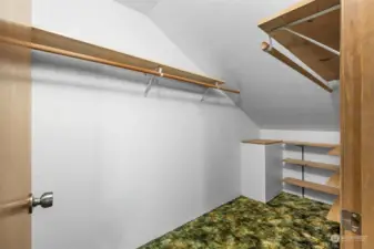 Primary bedroom walk in closet