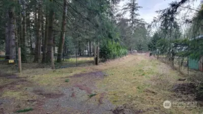 Road on the right of the front gate leads to the other permitted 2nd septic system out on the front of the property. this road is also part of the property, wide enough to drive your large 5th wheel out to your camping spot