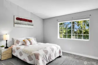Second bedroom with east facing morning light and vaulted ceilings.