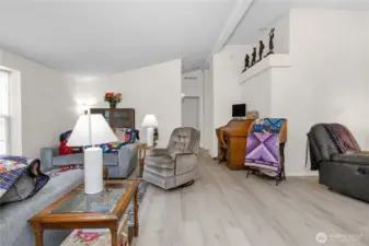 The spacious living room offers plenty of room to relax, gather, and make the space your own—whatever your needs may be.