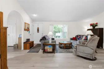 Here's another look at the cozy living room, beautifully finished with easy-care laminate flooring that adds warmth and charm to the space.