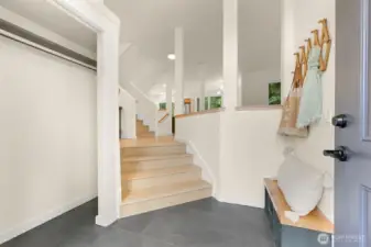 Private little landing as you enter with plenty of storage and a space to sit down to remove your shoes.