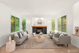 The living room remodel was just completed, and included new floors, fireplace, surround a custom mantel.