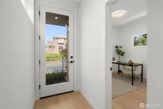 Bright and functional foyer welcomes you with airy openness, natural light, and a seamless flow toward the home’s heart.