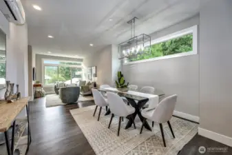 Great room filled with natural light and tranquil end of building setting.