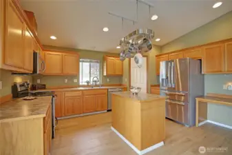 Large chef's kitchen with island offers ample cabinets & storage!