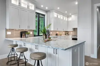 Well lit kitchen with under and upper cabinet lighting.