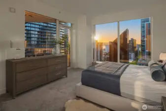 The primary suite feels like a boutique hotel retreat, complete with a spa-inspired bath, balcony access, and generous storage.