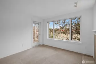Attached balcony deck with storage closet to keep you organized is perfect for relaxing and inviting the outdoors in.