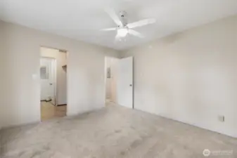 Primary Bedroom leads to private walk through closet and half bath.