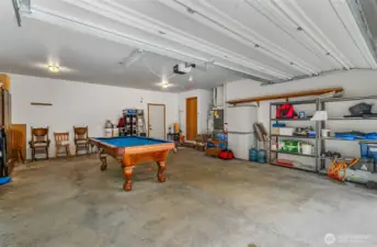 Large two car garage with storage area.  Brand new gas water heater.