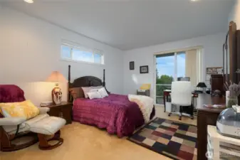 Spacious Main Floor Primary Bedroom with Sliding Door to Deck