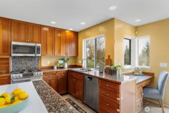 Open kitchen with island, solid granit counters & stainless-steel appliances!