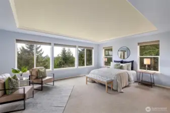 Well-appointed primary bedroom with commanding views!