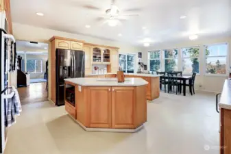 Chef's kitchen with tons of storage, double ovens, and durable hard surface countertops.