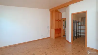 Primary Bedroom looking towards Walk In Closet and bathroom