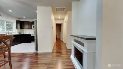 First look into the bright, great room effect, looking down the hallway, and kitchen