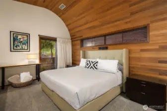 The bedroom opens onto its own small patio that accesses the back of the house with its built-in flower beds filled with herbs and lavender.