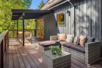 Another look across the composite deck. A stairwell is off to the left for easy access to the driveway, shed and property.