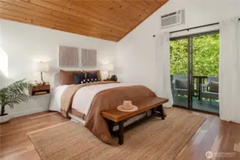 This enormous primary features a private deck, refinished hardwoods and a private bath.