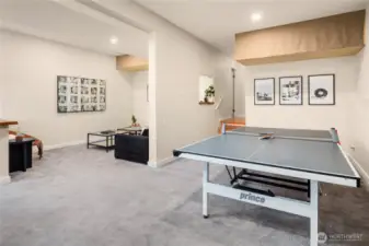 This shot of the rec room shows the enormity of both spaces with overhead storage (in addition to the massive storage room down the hall).