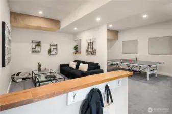 A tiled "mud room" is just off the lower entrance and open to the main rec room.