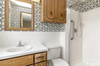 Primary bathroom with step-in shower.