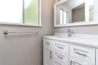 Main bathroom by bedrooms, 1/2 bath is back by office.