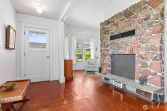The wood burning fireplace is the centerpiece of the current home.