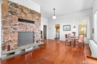 The dining room and living room flank the fireplace - it's a cozy space with an amazing view.