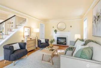 Living room with open staircase.