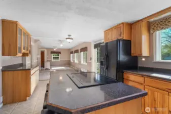 Kitchen with island/eating bar, laundry to the left