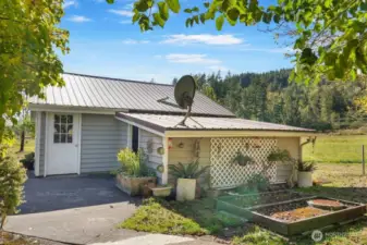 Lean to off garage with metal roof for storage