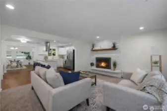 LIVING ROOM | Open Concept to kitchen and dining rooms *Fire is virtual