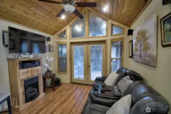 LIVING ROOM WITH CABINET/FIREPLACE AND TV