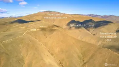 Backed by expansive federal land creating a natural buffer and open space